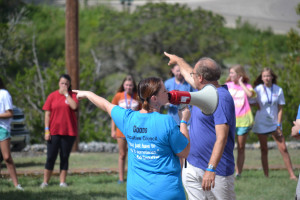 Choir directors Jenn Goodner and Ed Snouffer give students final information on how they will load onto the buses to head home from the weekend retreat.